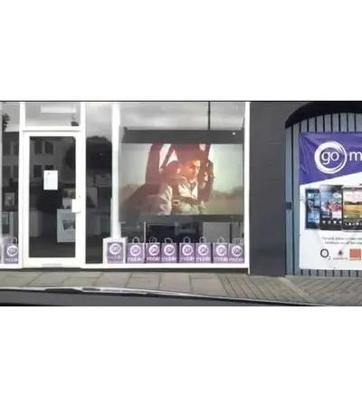 Converting glass storefronts into a display screen, 2 image Converting glass storefronts into a display screen, 2 image