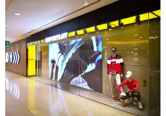 Converting glass storefronts into a display screen